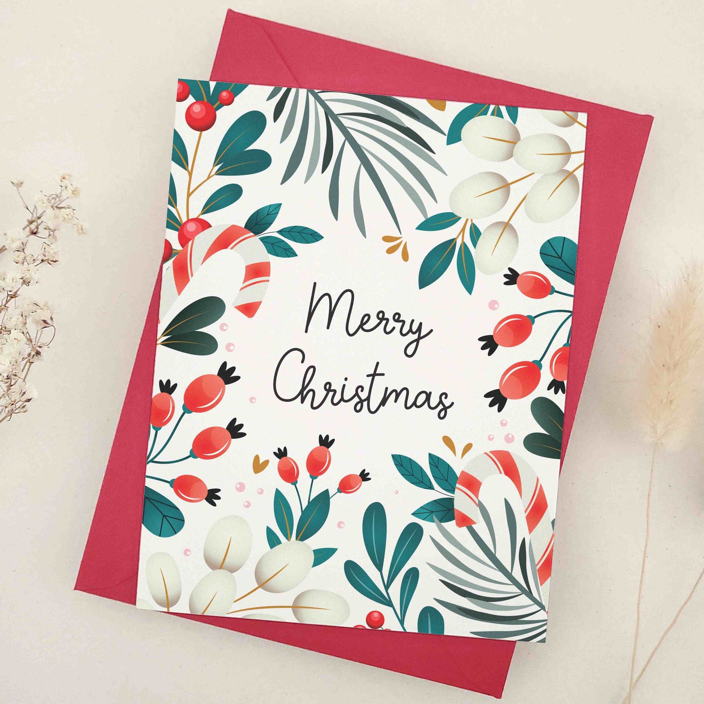 Share the warmth and joy of the holiday season with our beautiful 'Merry Christmas' card, featuring an elegant array of festive motifs including mistletoe, berries, and candy canes against a traditional winter backdrop, a perfect canvas for sending your holiday wishes.