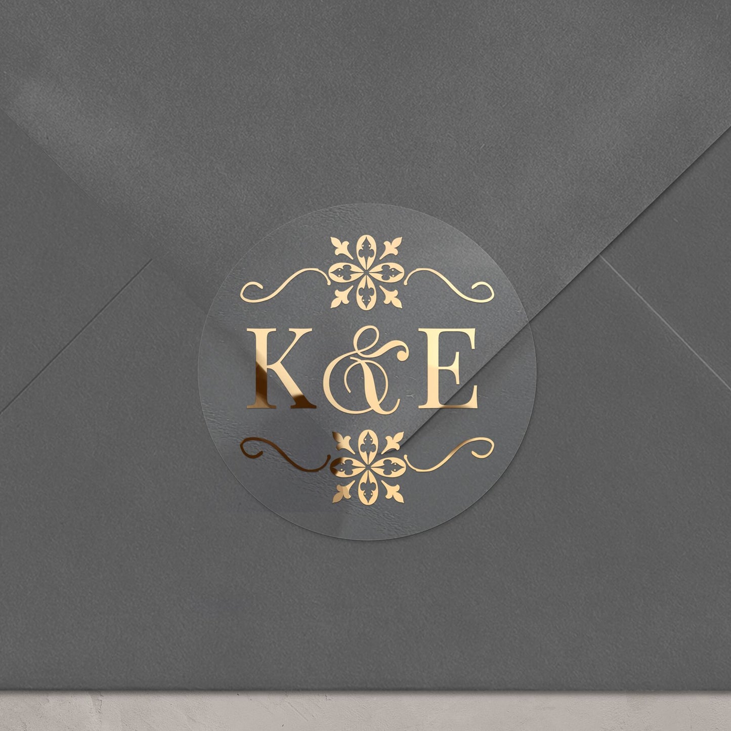 Transparent monogrammed wedding sticker with gold ornaments design and custom initials