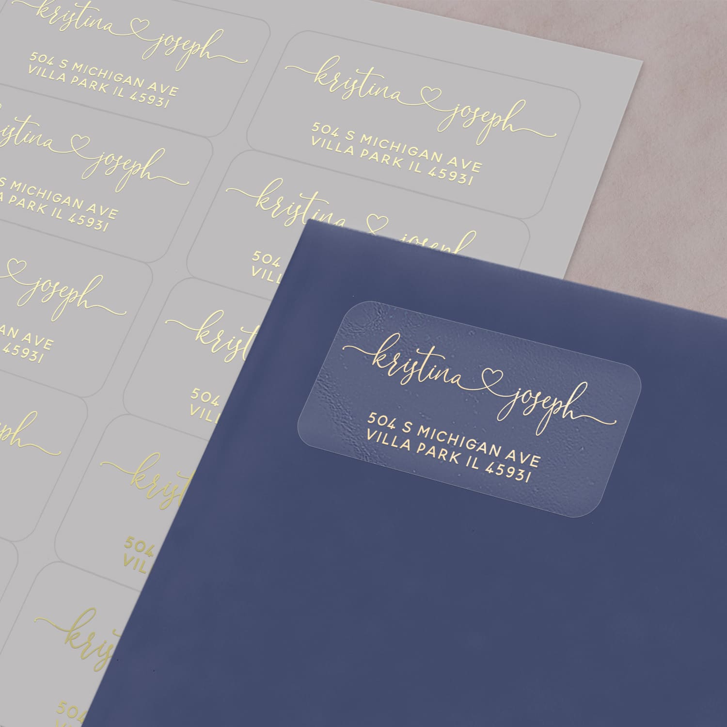 XOXOKristen custom clear return address label with white print, heart design connecting names, shown applied to envelope - XOXOKristen