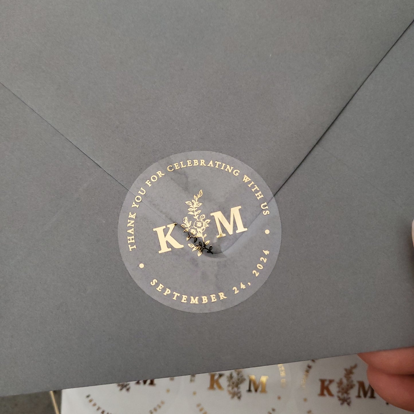 gold foiled monogram wedding favor sticker with thank you for celebrating with us text and floral design, personalized with initials and wedding date - XOXOKristen