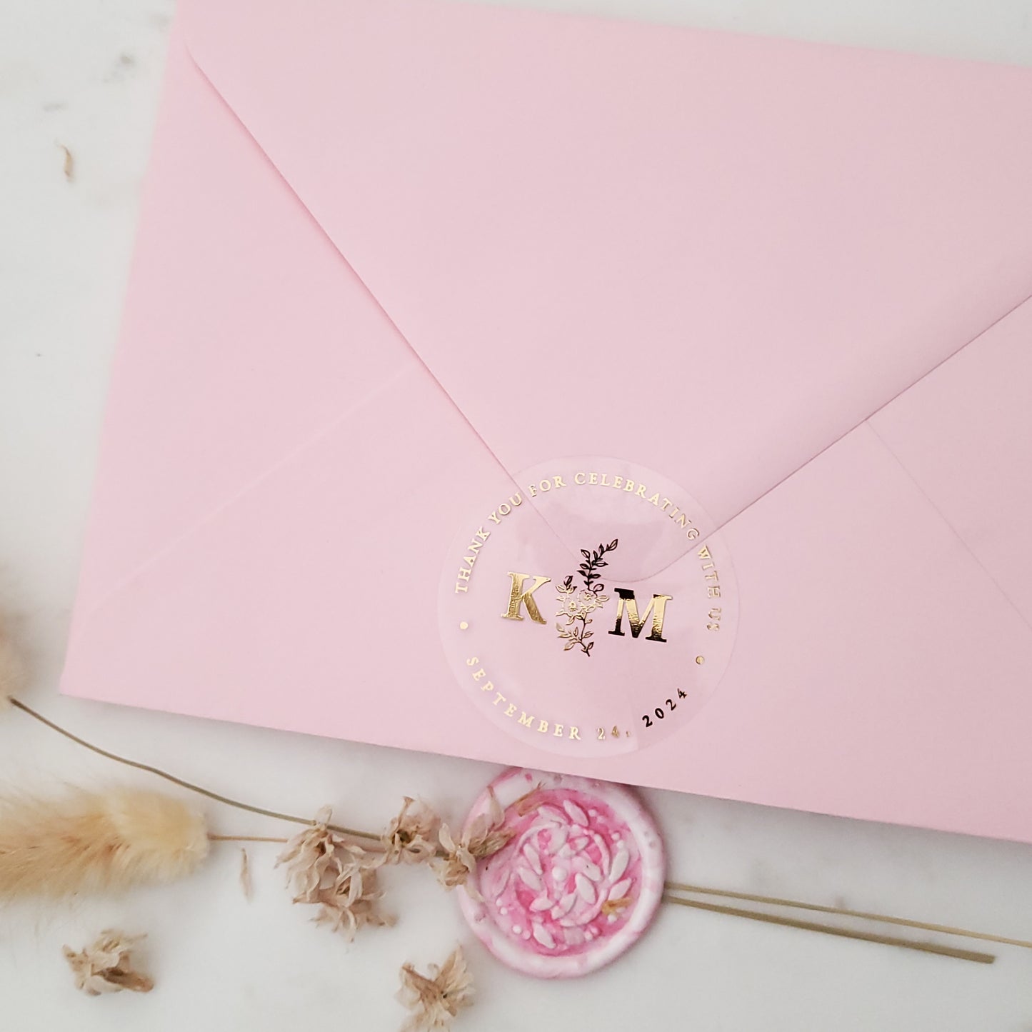 gold foiled monogram wedding favor sticker with thank you for celebrating with us text and floral design, personalized with initials and wedding date - XOXOKristen