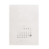 Elegant vellum Save the Date invitation printed in reflective silver foil, featuring a calendar design and delicate mix of serif and cursive lettering on translucent frosted paper for timeless luxury stationery – XOXOKristen