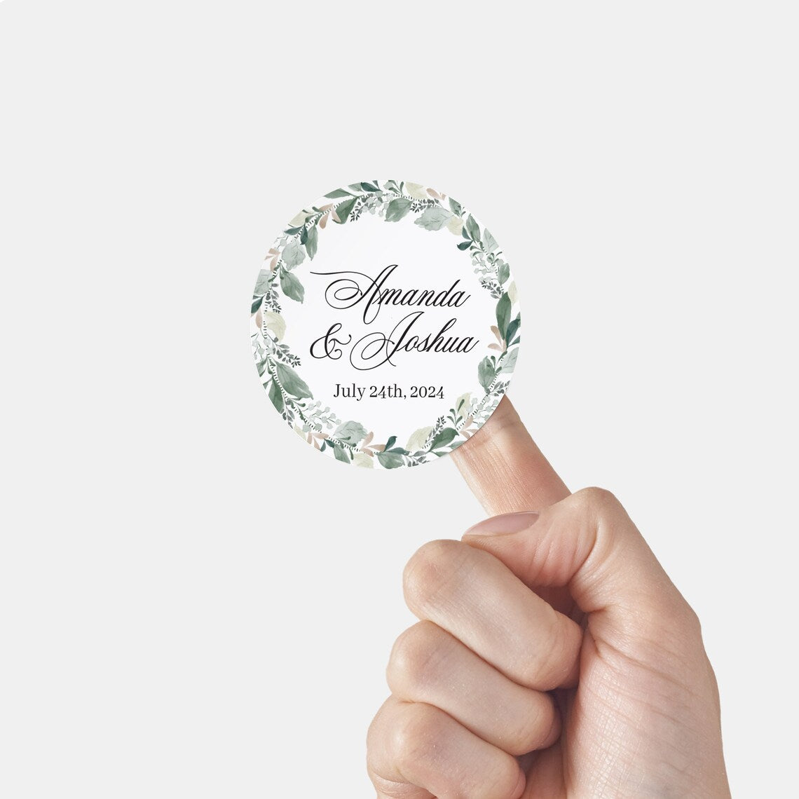 Elegant wedding sticker with genery wreath, personalized with names and wedding date.