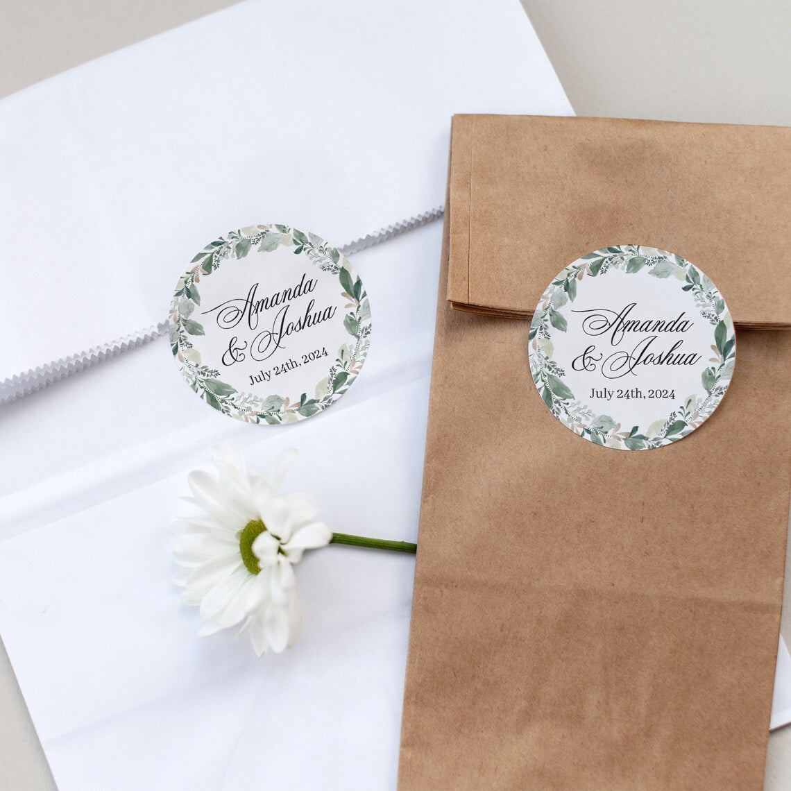 Elegant wedding sticker with genery wreath, personalized with names and wedding date.