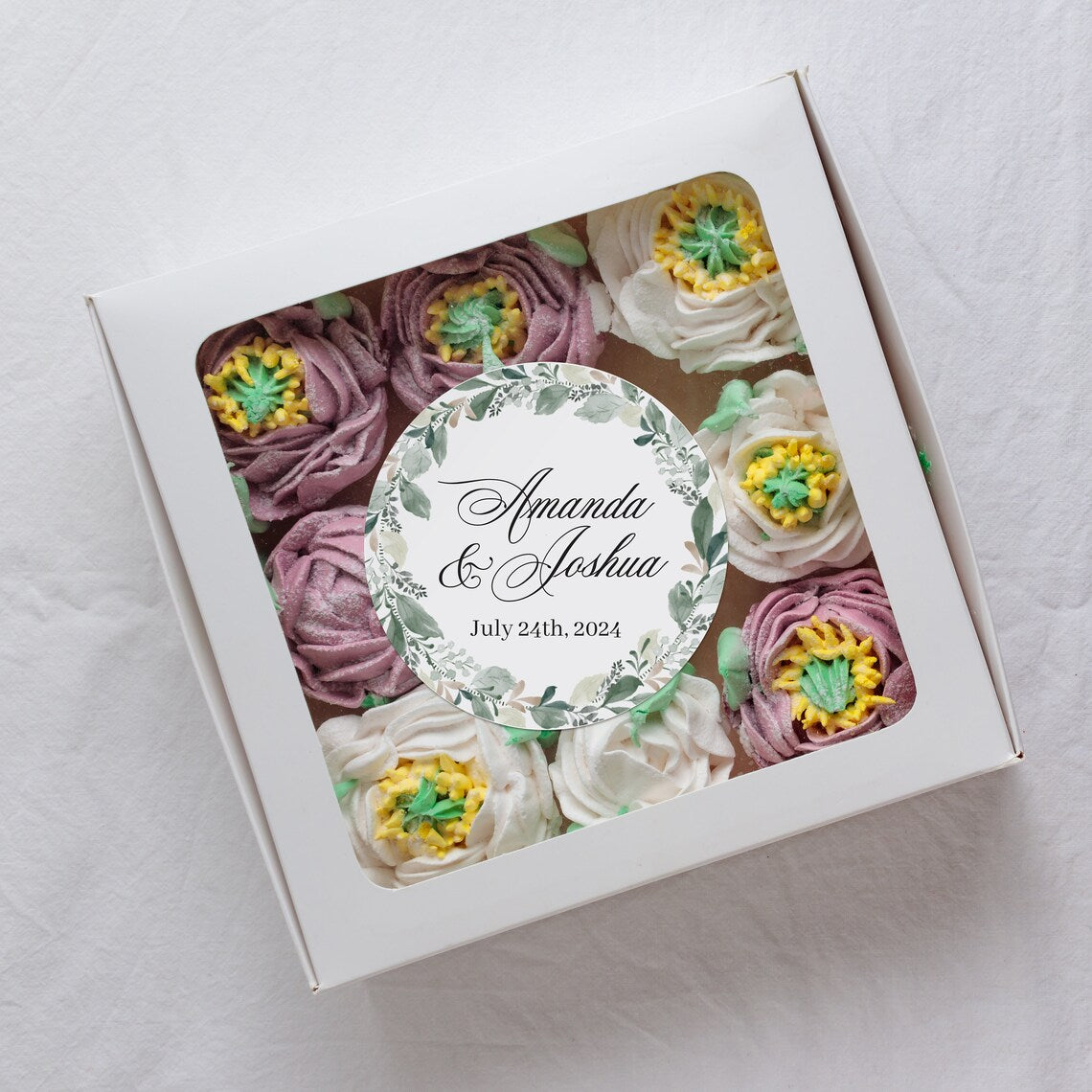Elegant wedding sticker with genery wreath, personalized with names and wedding date.