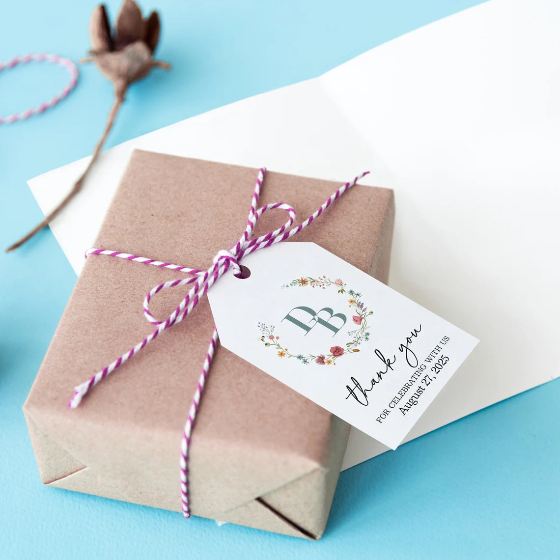 Elegant personalized monogram wedding favor tags with watercolor wildflowers wreath.