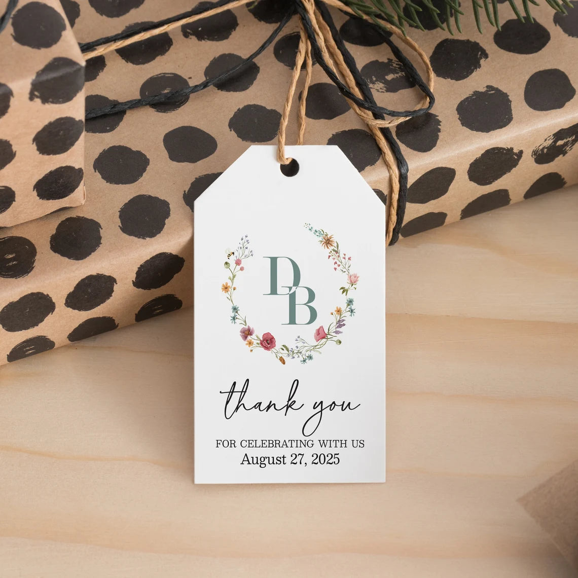 Elegant personalized monogram wedding favor tags with watercolor wildflowers wreath.