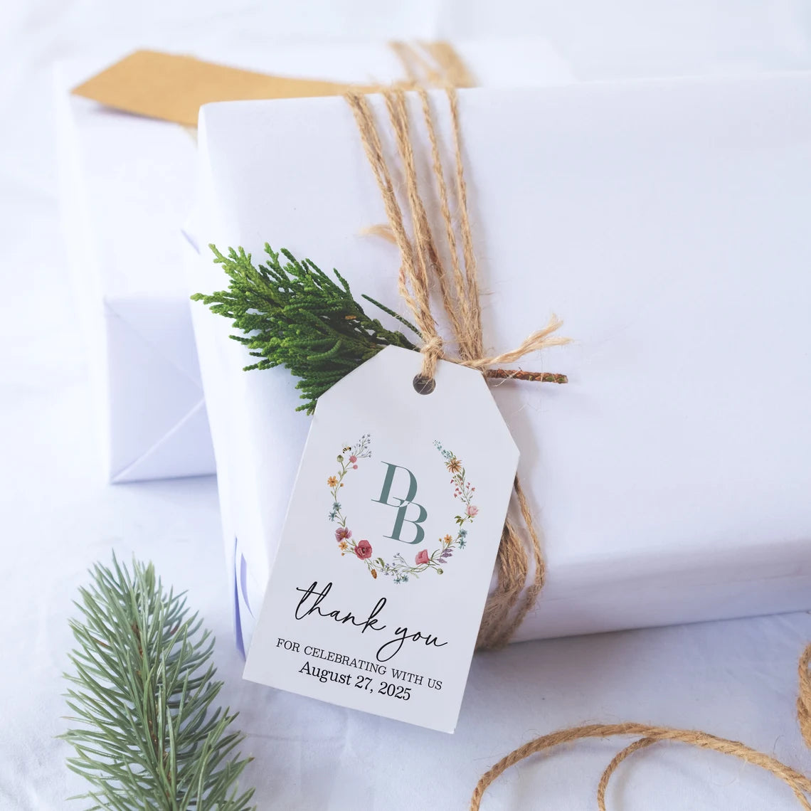 Elegant personalized monogram wedding favor tags with watercolor wildflowers wreath.