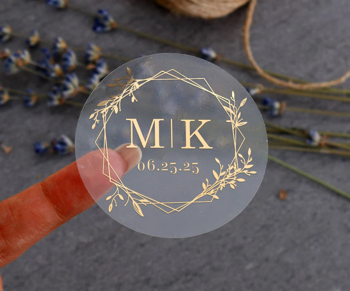 Minimalistic personalized wedding sticker with monograms, date, and floral frame on clear background