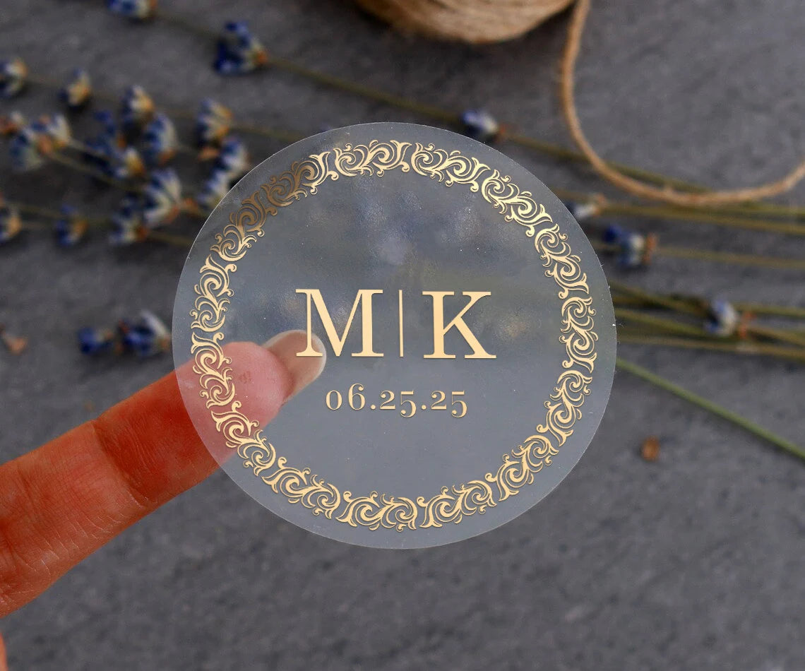 Personalized wedding sticker with monograms, date, and black ornate frame on clear background