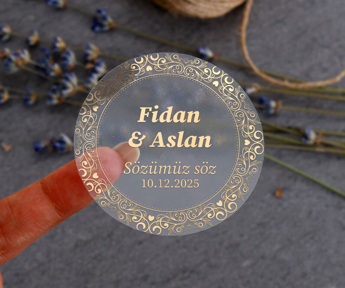Personalized gold-foil commitment sticker with names, message, and date