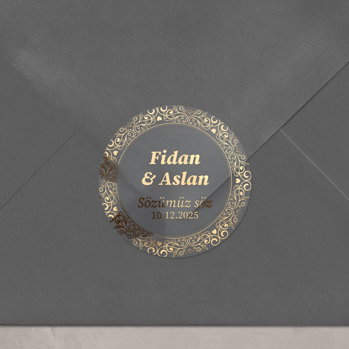 Personalized gold-foil commitment sticker with names, message, and date