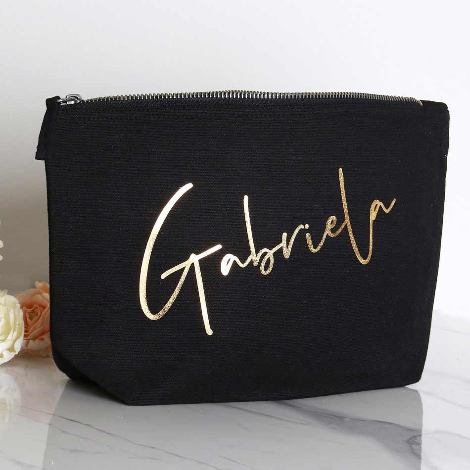 Bridesmaid gift cosmetic pouch. Personalized with real gold foiled handwritten name ā XOXOKristen
