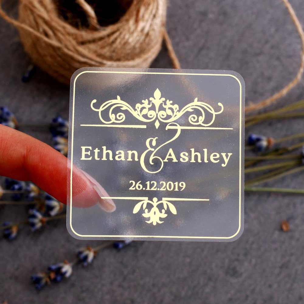 Custom wedding sticker with ornaments and gold foiled lettering. Entirely personalized clear labels.