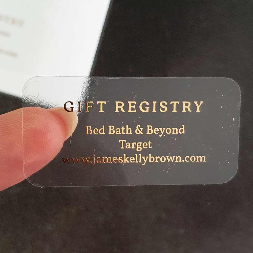 Custom wedding girt registry sticker with real gold foiled lettering. Entirely personalized clear label.