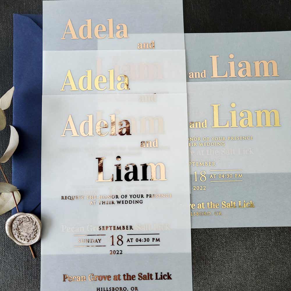 Elegant vellum wedding invitations with gold foiled writing - XOXOKristen