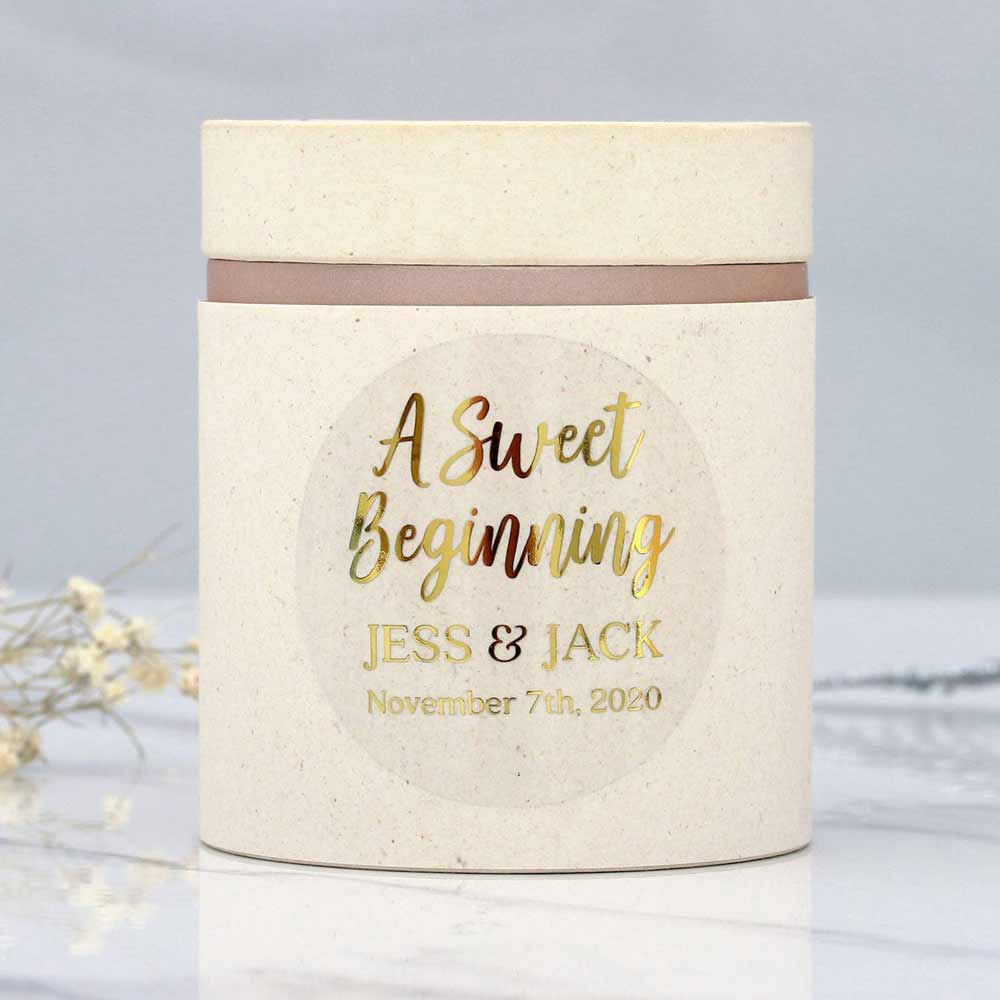 Custom wedding sweet beginnings sticker with real gold foiled lettering. Entirely personalized clear labels.