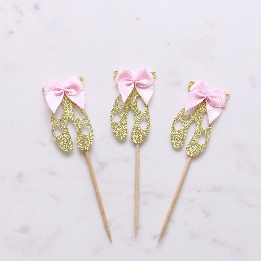 Gold glittered ballerina shoes cupcake topper with pink satin bow decoration - XOXOKristen