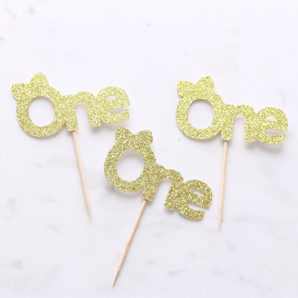 gold glitter first birthday cupcake decoration with cute bow - xoxokristen