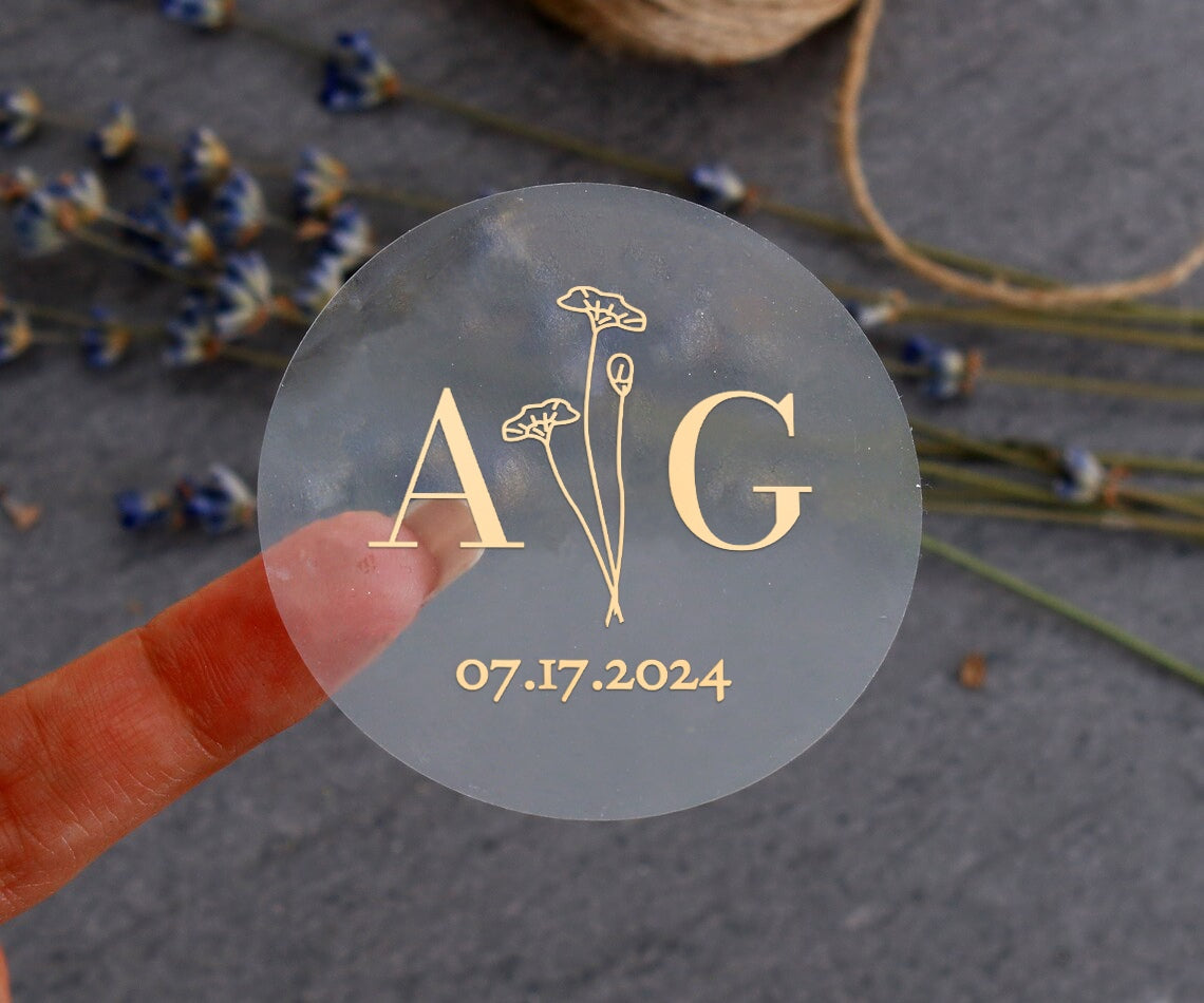 Elegant transparent sticker with initials, date and flowers for wedding invitations, seals and favors.