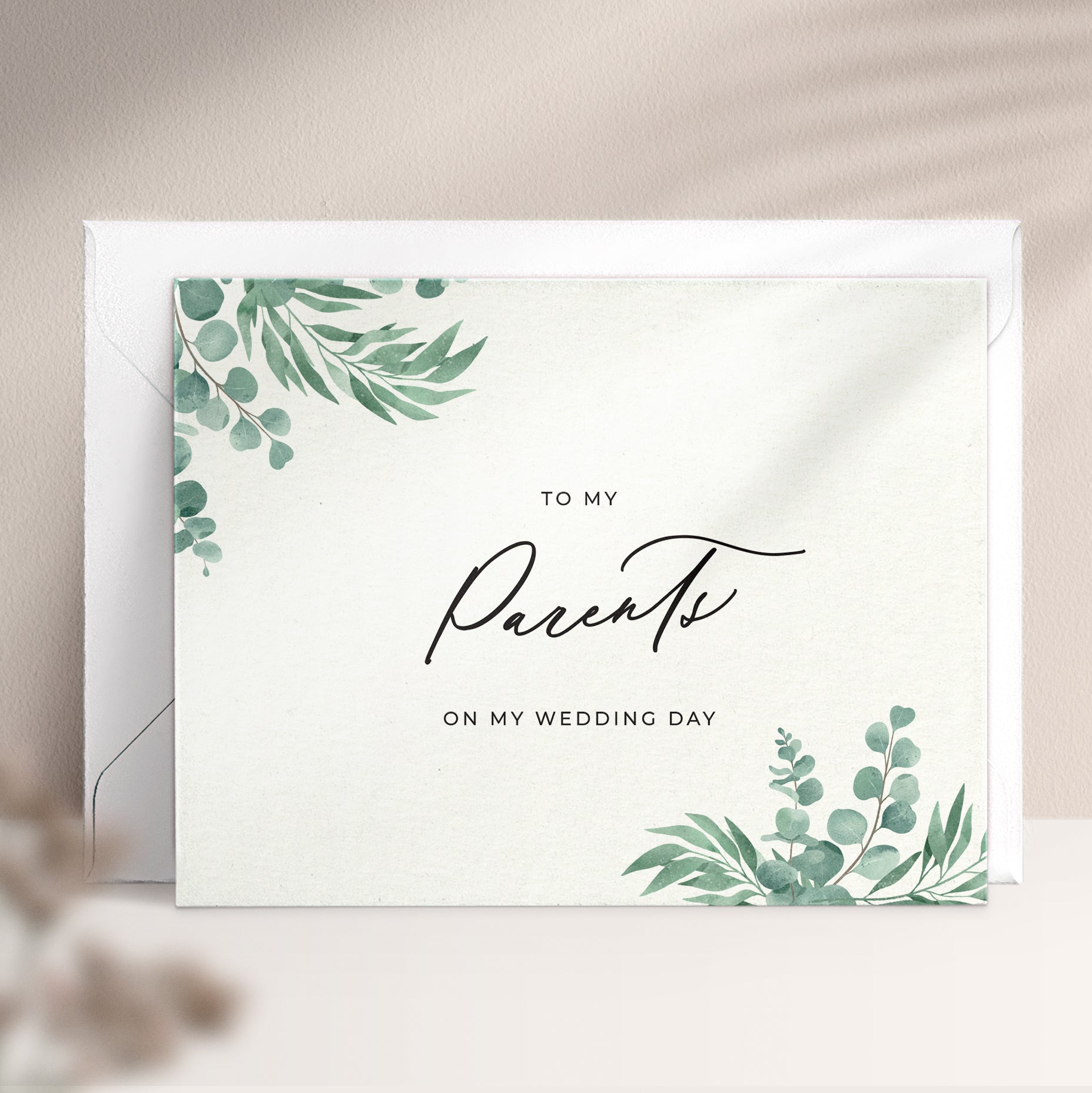 To my parents on my wedding day note card in greenery design with eucalyptus leaves and calligraphy font from XOXOKristen.