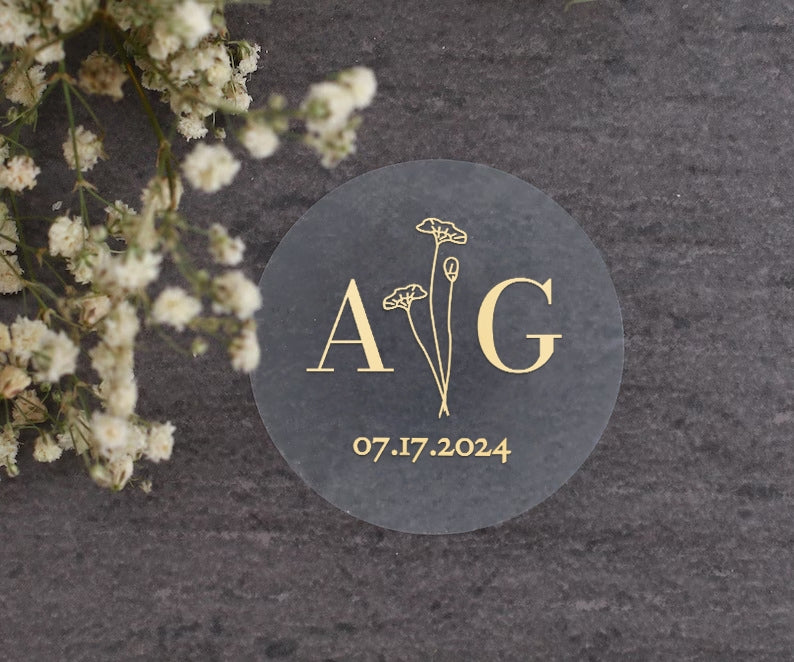 Elegant transparent sticker with initials, date and flowers for wedding invitations, seals and favors.