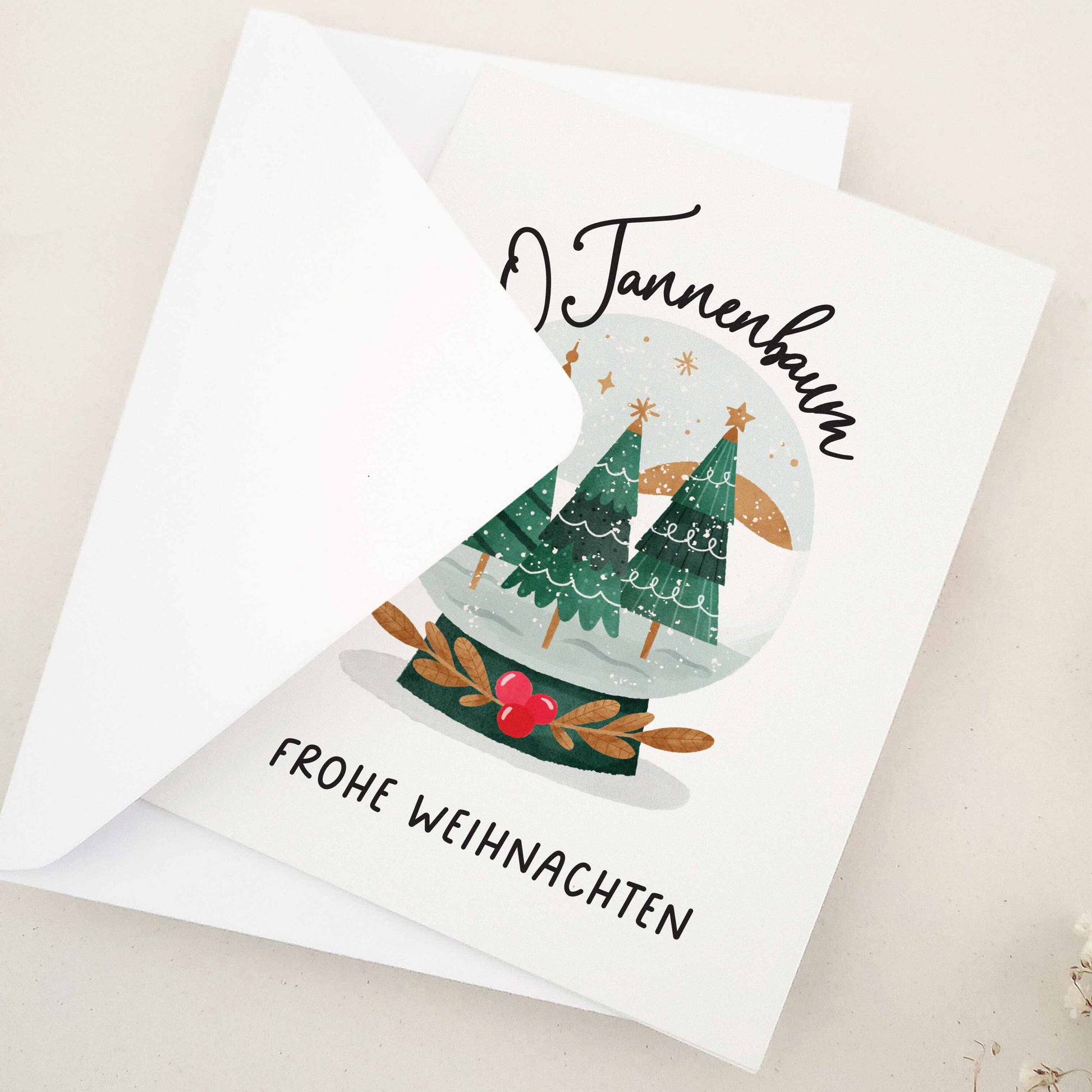Enchanting 'O Tannenbaum, Frohe Weihnachten' card, paying homage to the classic German Christmas carol. Features a serene snow globe scene with evergreen trees, capturing the essence of 'O Tannenbaum'. The imagery creates a magical, peaceful winter evening atmosphere, reflecting the enduring charm and warmth of the holiday season.