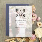 Classic vellum save-the-date photo card with custom monogram, elegant typography, and minimalist text printed on semi-transparent vellum paper, backed with a photo print.