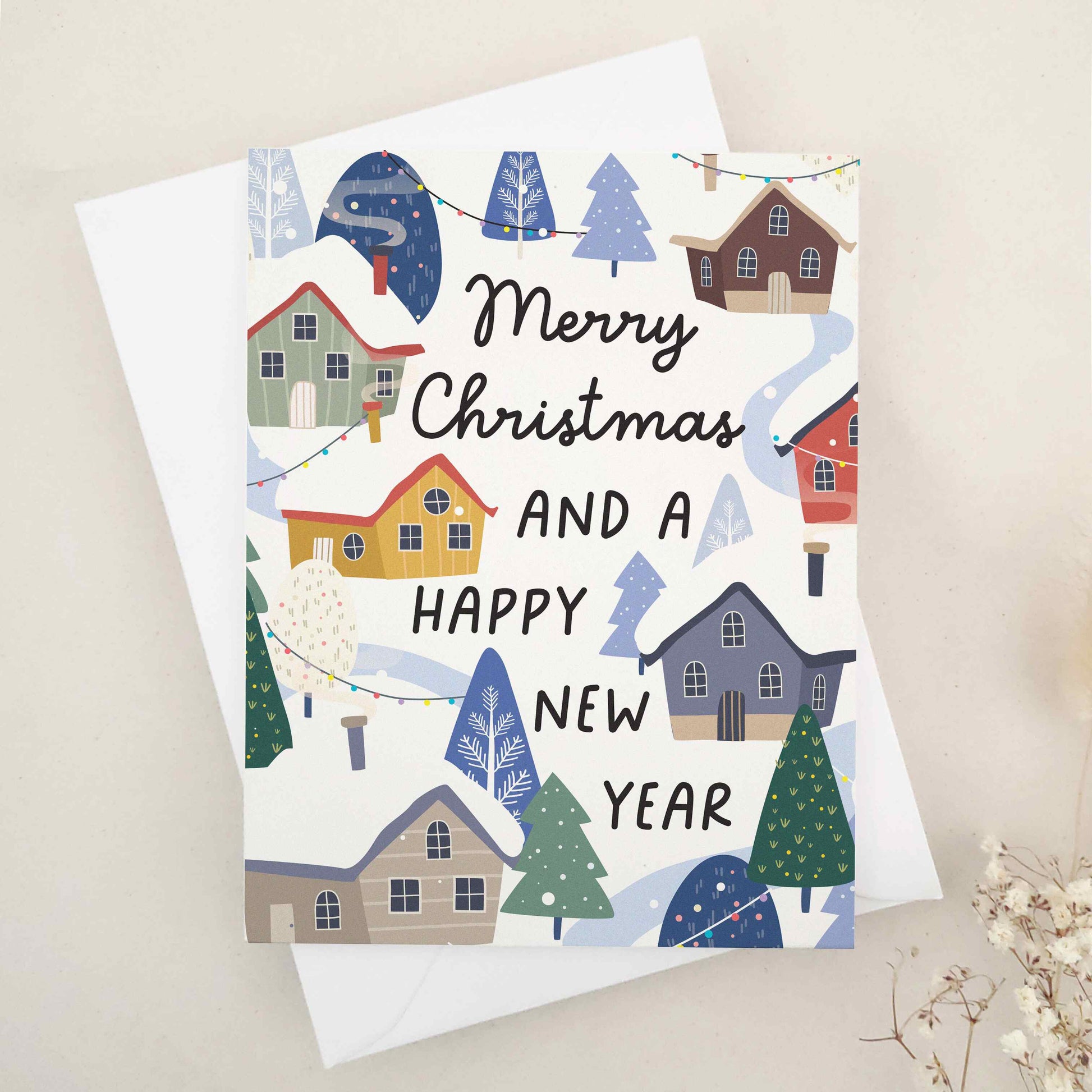 Elegant 'Merry Christmas and a Happy New Year' card depicting a cozy winter scene with snow-covered houses and festive decorations. The design vividly captures the serene and joyous atmosphere of the holiday season, highlighting the warmth and charm of winter celebrations, ideal for sharing heartfelt season's greetings and best wishes.