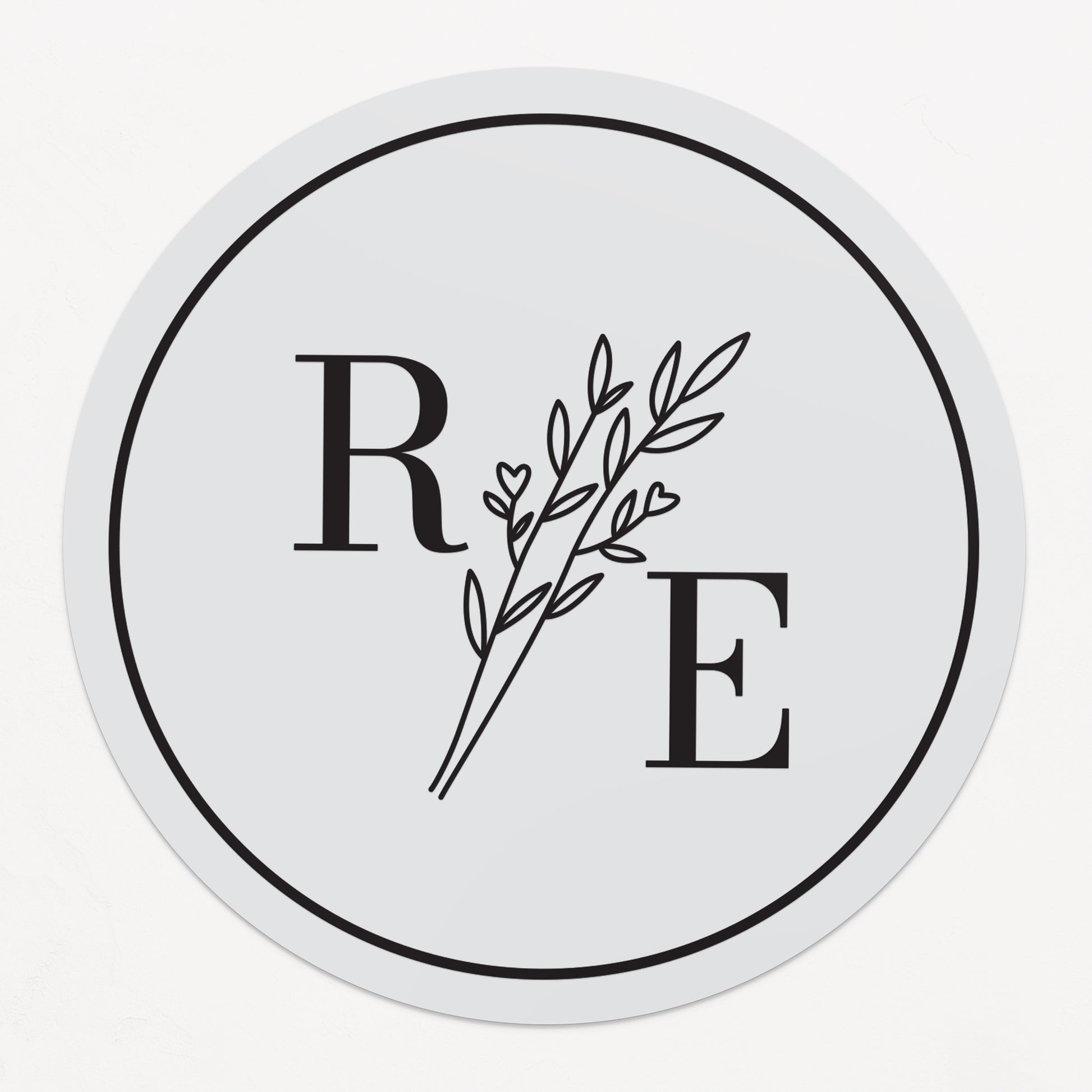 Clear custom wedding sticker with golden initials and botanical illustration.