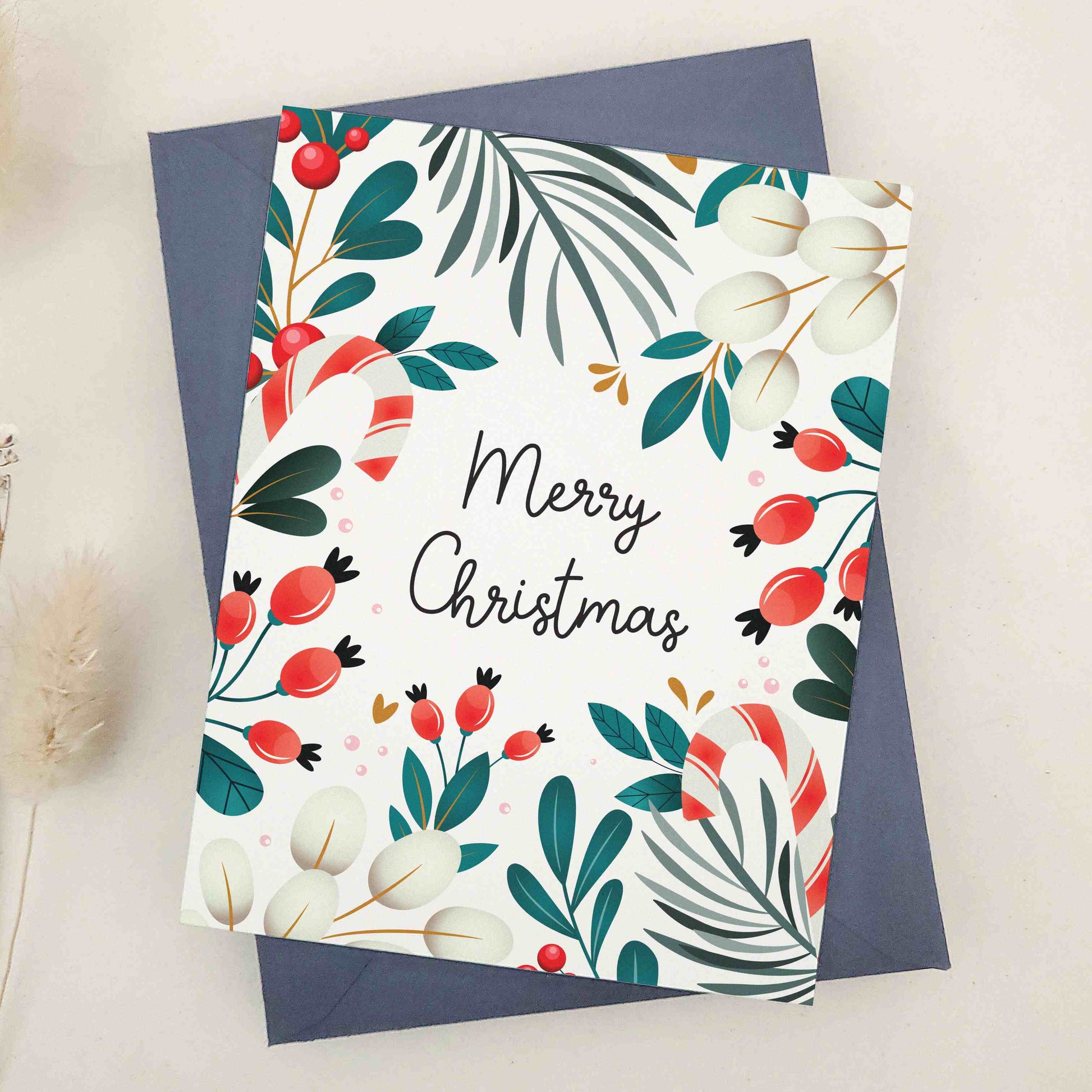 Share the warmth and joy of the holiday season with our beautiful 'Merry Christmas' card, featuring an elegant array of festive motifs including mistletoe, berries, and candy canes against a traditional winter backdrop, a perfect canvas for sending your holiday wishes.