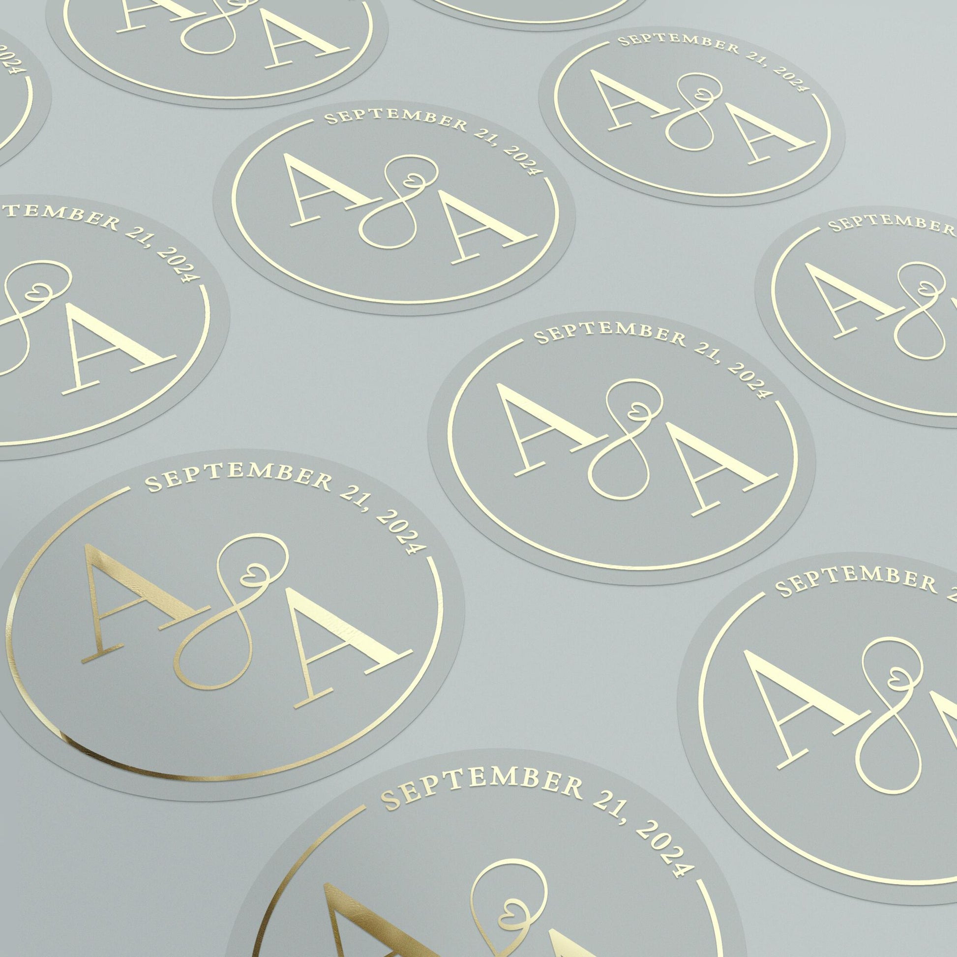 Transparent wedding sticker with gold initials and date, decorated with elegant infinity sign.