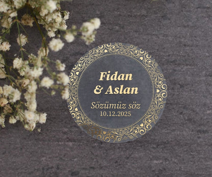 Personalized gold-foil commitment sticker with names, message, and date