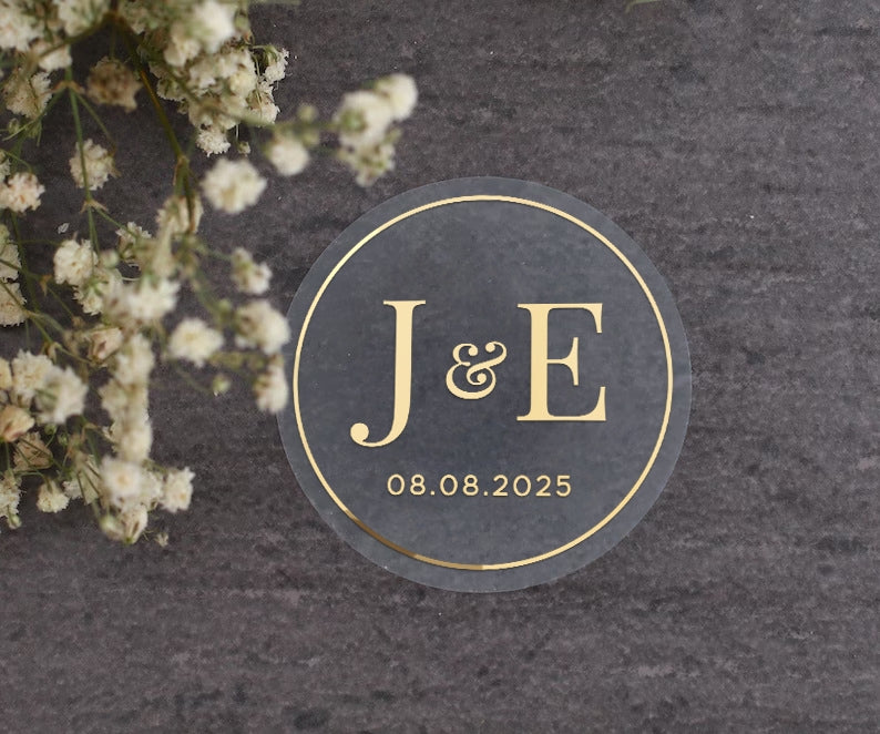 Elegant clear wedding sticker with monogram initials and custom wedding date. 