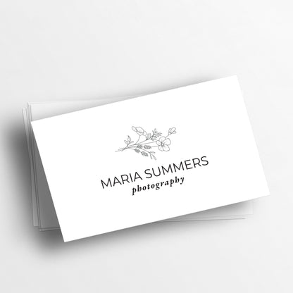 Sleek black and white personalized business cards from XOXOKristen, showcasing a floral illustration and a variety of luxurious text printing options.