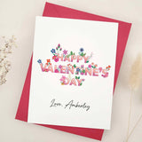 Personalized Valentine’s card with colorful flower-filled lettering, red envelope – XOXOKristen