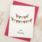 Holiday card with Merry Christmas bunting design, styled with red envelope – XOXOKristen