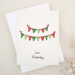 Merry Christmas greeting card with red and green bunting banner design, paired with white envelope – XOXOKristen