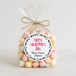 XOXOKristen personalized round Valentine’s Day sticker on a clear bag filled with pastel marshmallows, red and black heart border design – XOXOKristen