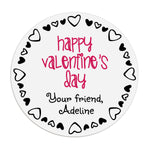 XOXOKristen round Valentine’s Day sticker close-up, white label with playful black heart outline and pink lettering – XOXOKristen