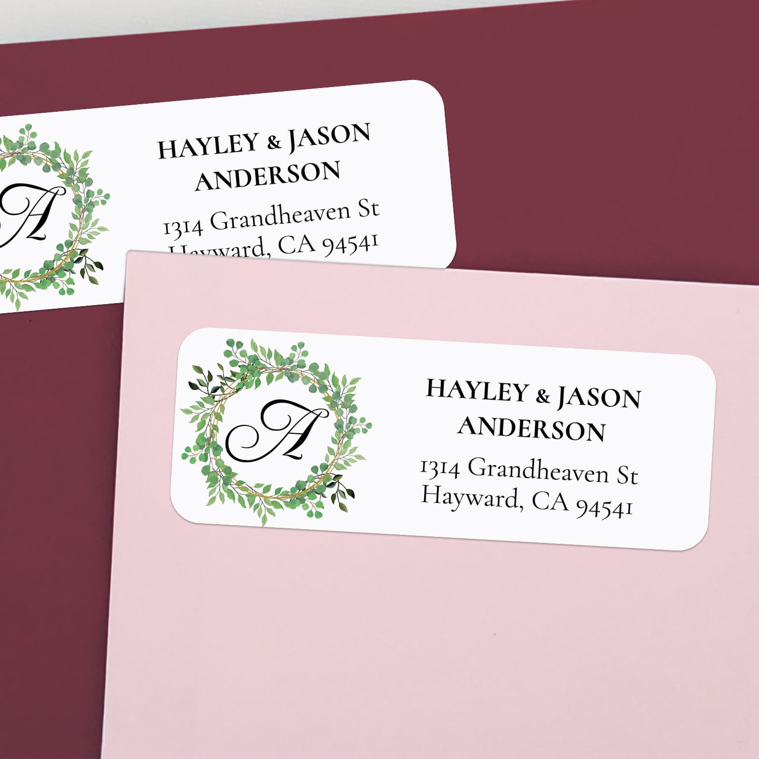 XOXOKristen personalized greenery wreath return address label with white background, leafy circle design, monogram letter, and bold serif text - XOXOKristen