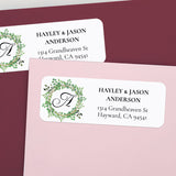 XOXOKristen personalized greenery wreath return address label with white background, leafy circle design, monogram letter, and bold serif text - XOXOKristen