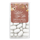 Elegant wedding sticker design with brown background, cascading florals, and romantic script, tailored for personalized Tic Tac wedding favors.