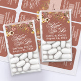 Elegant wedding sticker design with brown background, cascading florals, and romantic script, tailored for personalized Tic Tac wedding favors.