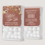 Personalized wedding Tic Tac sticker in rustic terracotta with floral border design, used as a custom label for mint favor boxes.