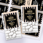 XOXOKristen milestone birthday Tic Tac favor boxes decorated with “Aged to Perfection” stickers in black and beige stripe pattern – XOXOKristen