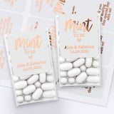 XOXOKristen custom rose gold foiled Mint to Be wedding stickers with modern script font, heart motif, and bride groom names for Tic Tac boxes.