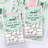 Personalized Mint To Be wedding favor label in mint green with black floral line art design, applied on Tic Tac box with white mints.