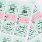 Sheet of Mint To Be personalized wedding labels in mint green and pink with botanical black floral artwork for DIY Tic Tac favors.
