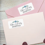 XOXOKristen custom floral address labels on pastel pink envelopes, featuring a central flower motif and modern typography - XOXOKristen